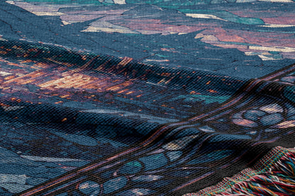 The image is a close-up view of a textured fabric with a colorful, abstract pattern. The fabric appears to be a textile or textile-like material, with a variety of colors and shapes creating a visually striking design.