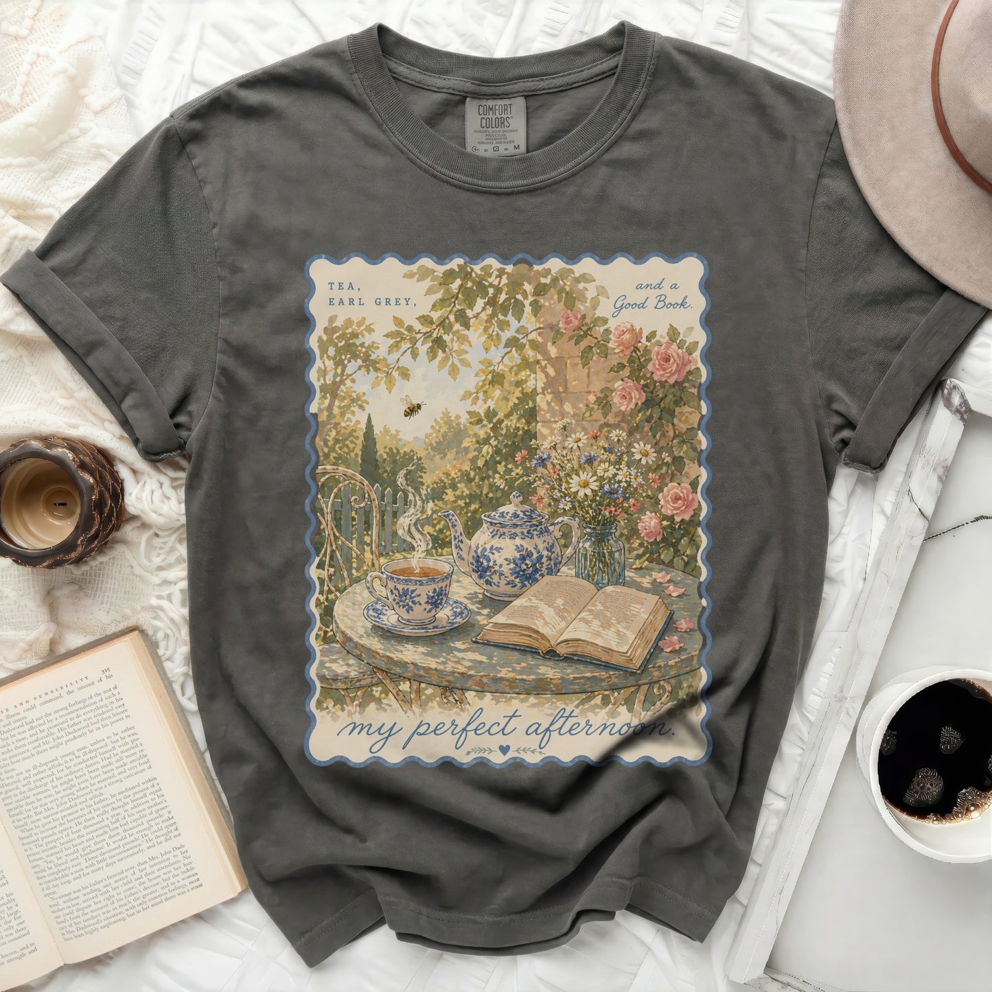 T-shirt with "Tea, Earl Grey, and a Good Book" and a garden scene.