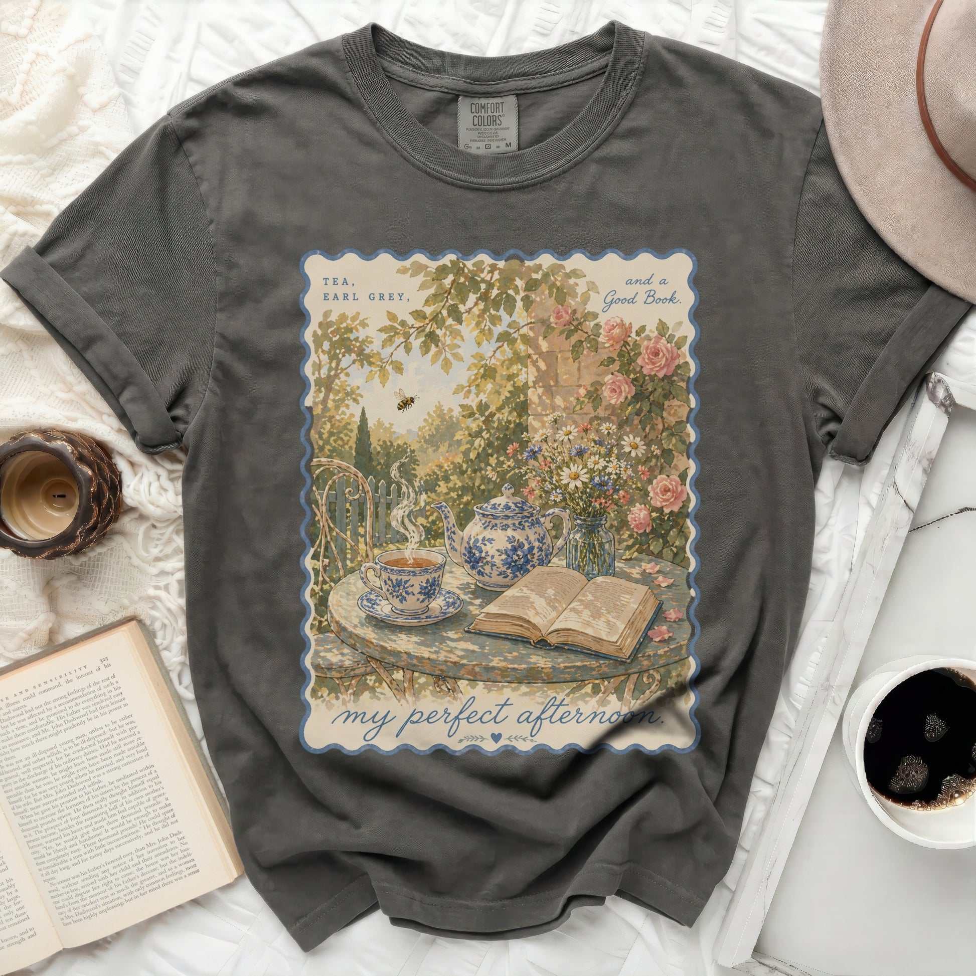 T-shirt with "Tea, Earl Grey, and a Good Book" and a garden scene.