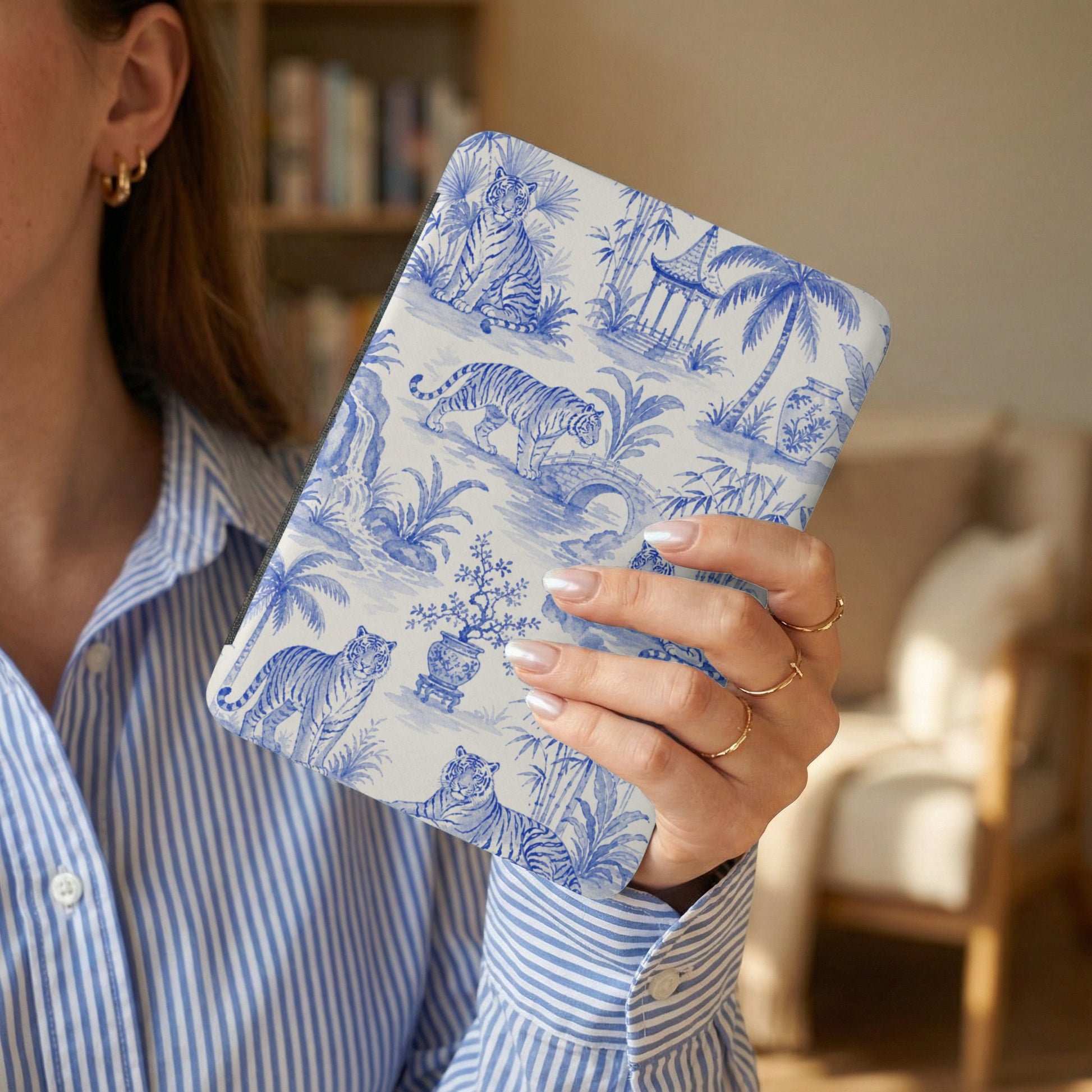 Blue and white toile pattern device case with tigers and pagodas.