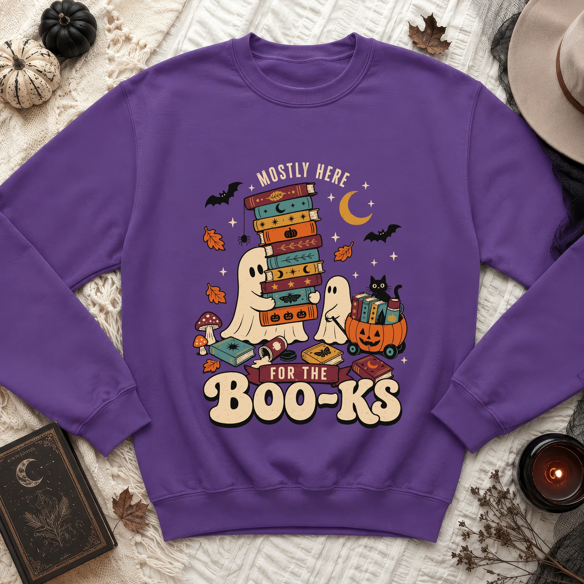 Purple sweatshirt with ghosts, books, bats, and "Mostly Here For The Boo-Ks" text.