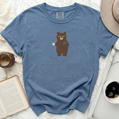 Blue t-shirt with a cartoon bear holding a book and coffee mug.