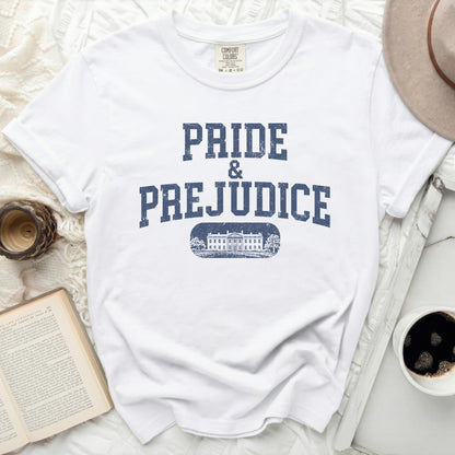 White Comfort Colors t-shirt with "Pride & Prejudice" and a building graphic.