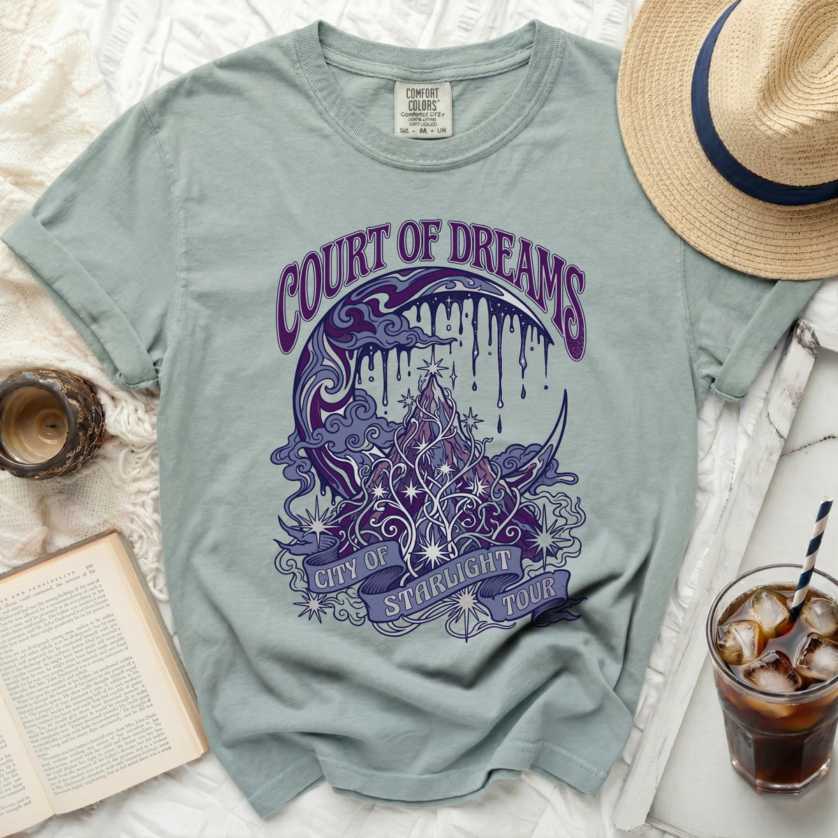 Light blue t-shirt with "Court of Dreams City of Starlight Tour" graphic.
