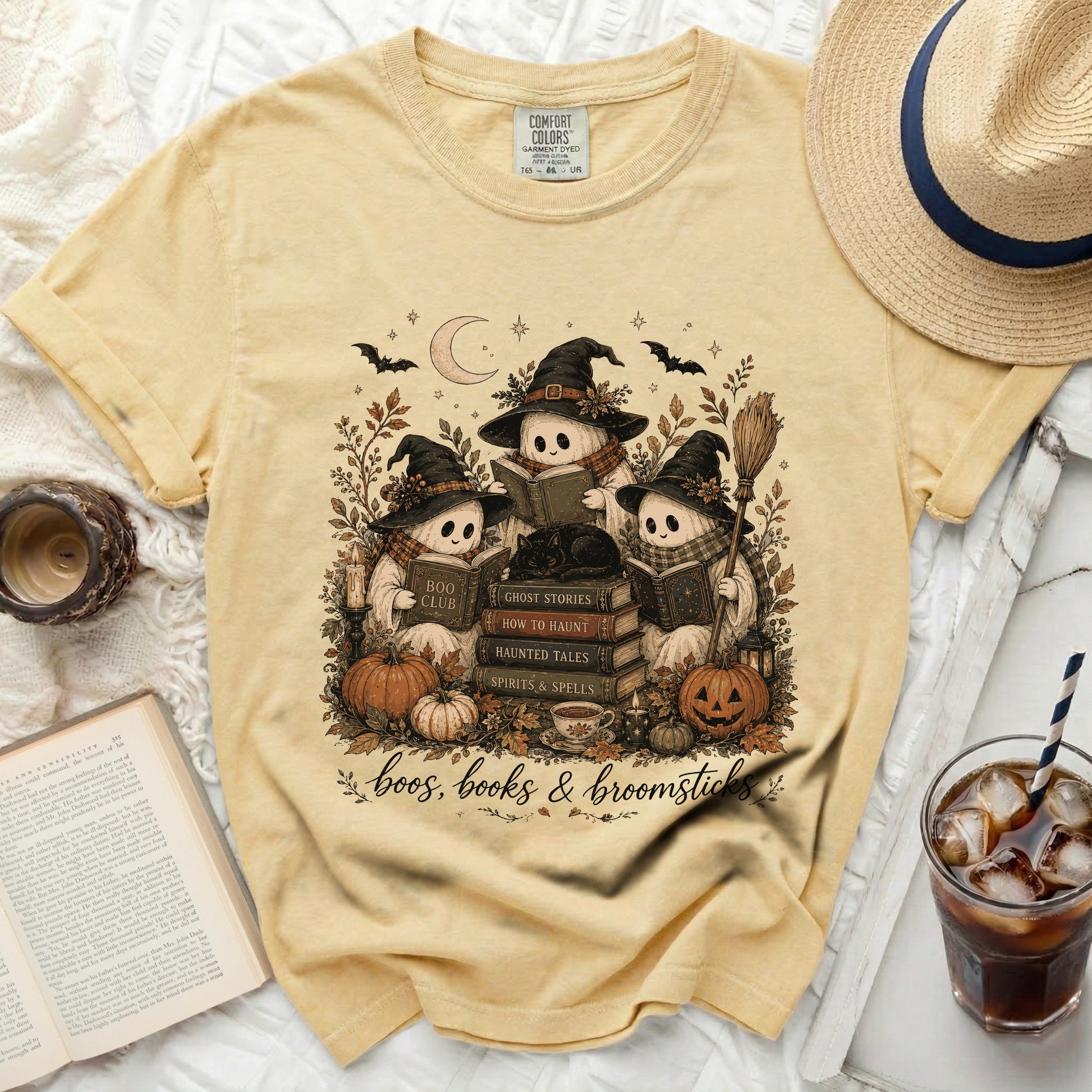 Yellow t-shirt with ghosts reading and "boos, books & broomsticks" text.