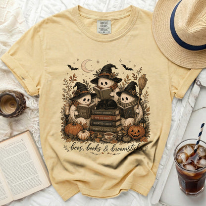 Yellow t-shirt with ghosts reading and "boos, books & broomsticks" text.