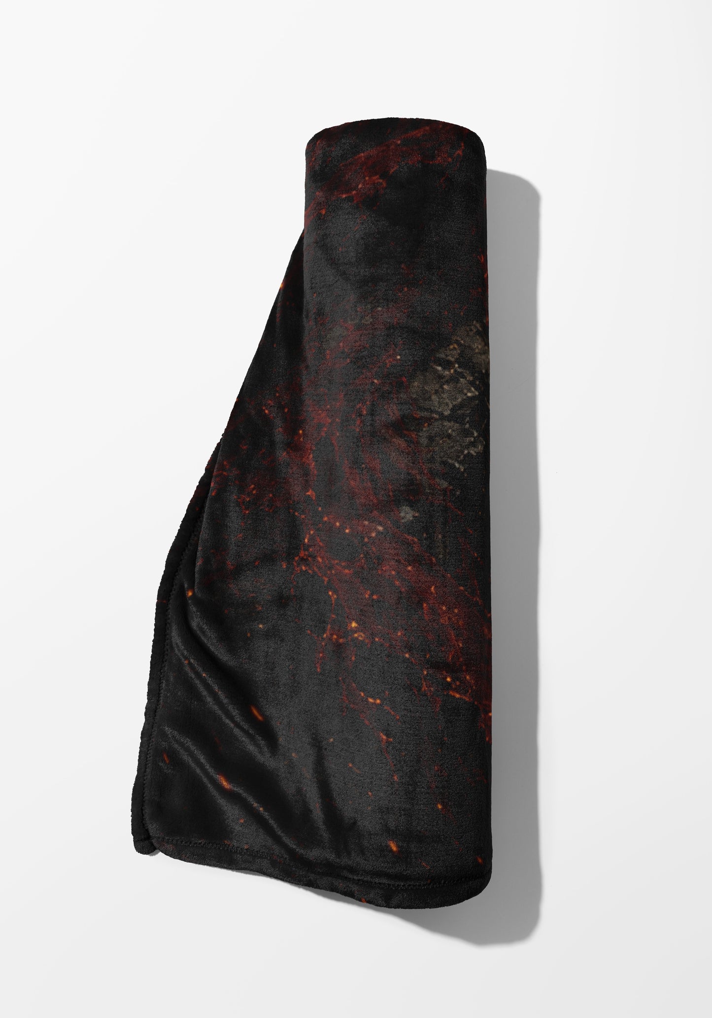 Rolled blanket with black and red marble pattern on white background.