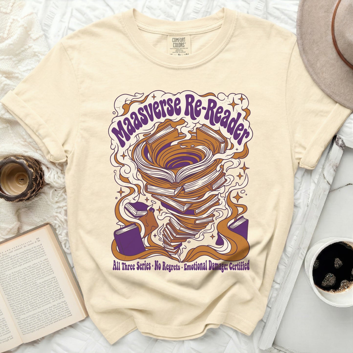 Cream t-shirt with "Maasverse Re-Reader" text and swirling book tornado design.