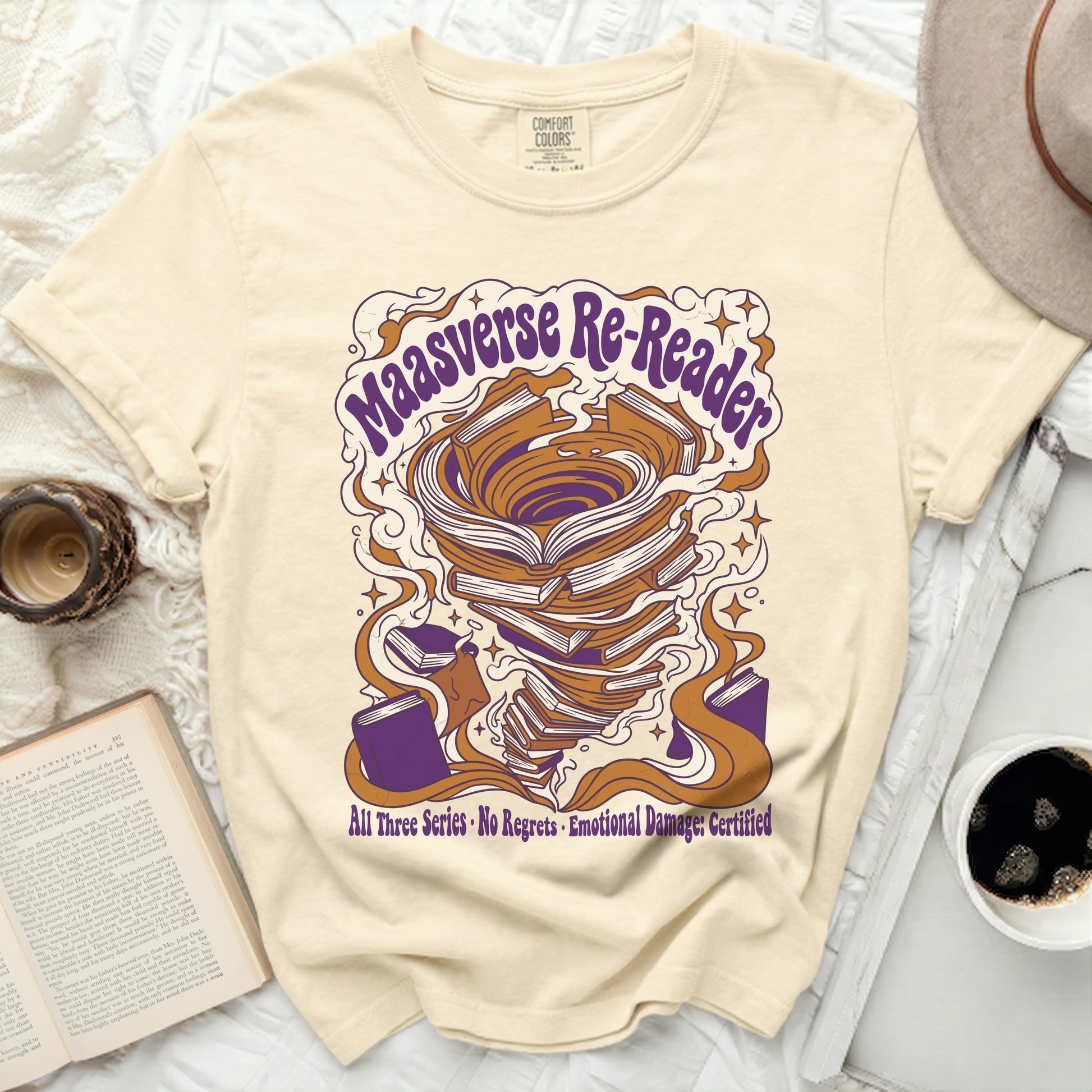 Cream t-shirt with "Maasverse Re-Reader" text and swirling book tornado design.
