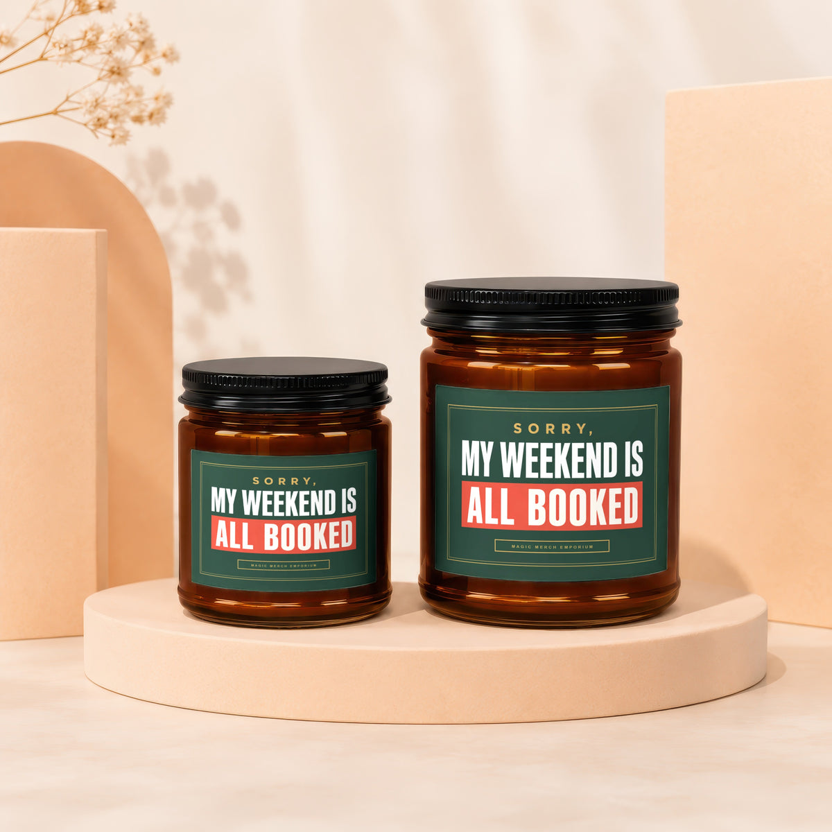 Two amber candles with "My Weekend Is All Booked" text on green labels.