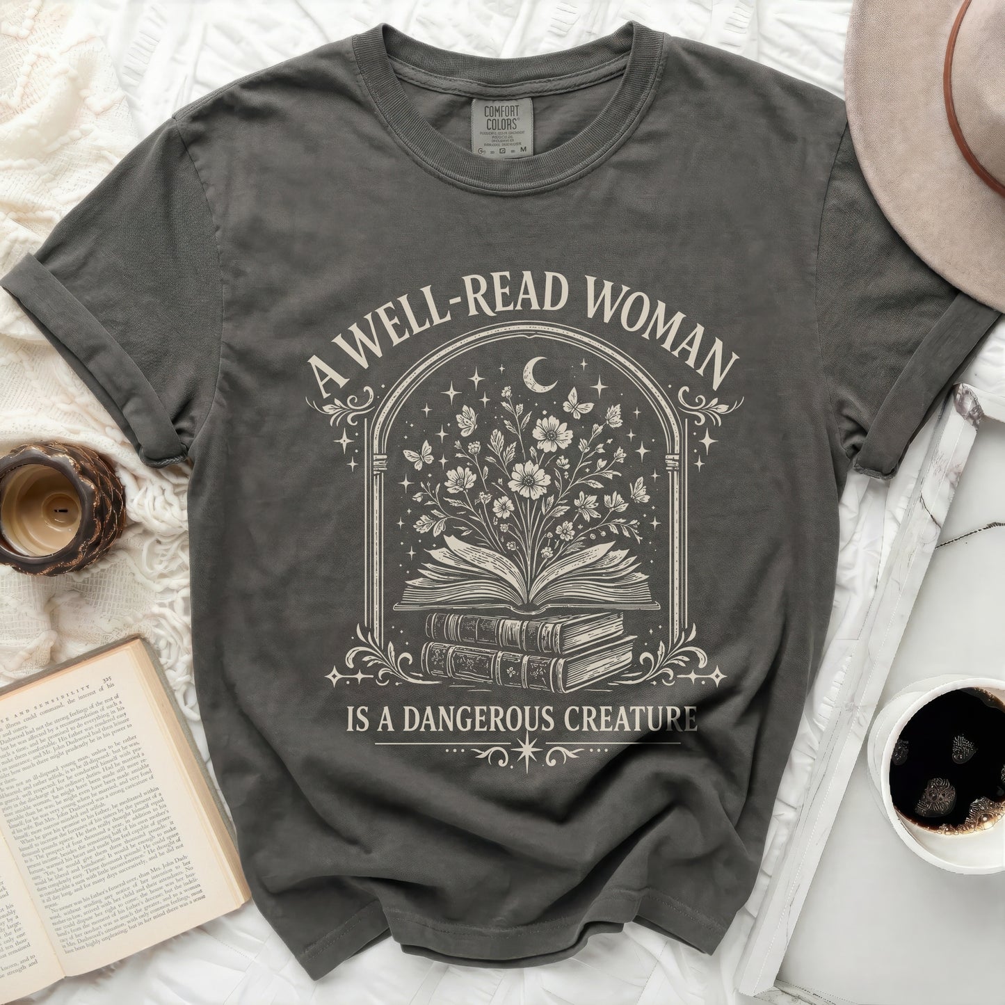 A well-read woman is a dangerous creature graphic tee.