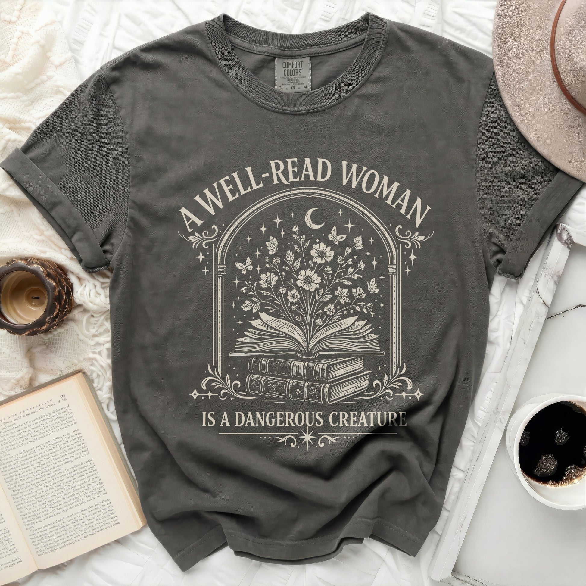 A well-read woman is a dangerous creature graphic tee.