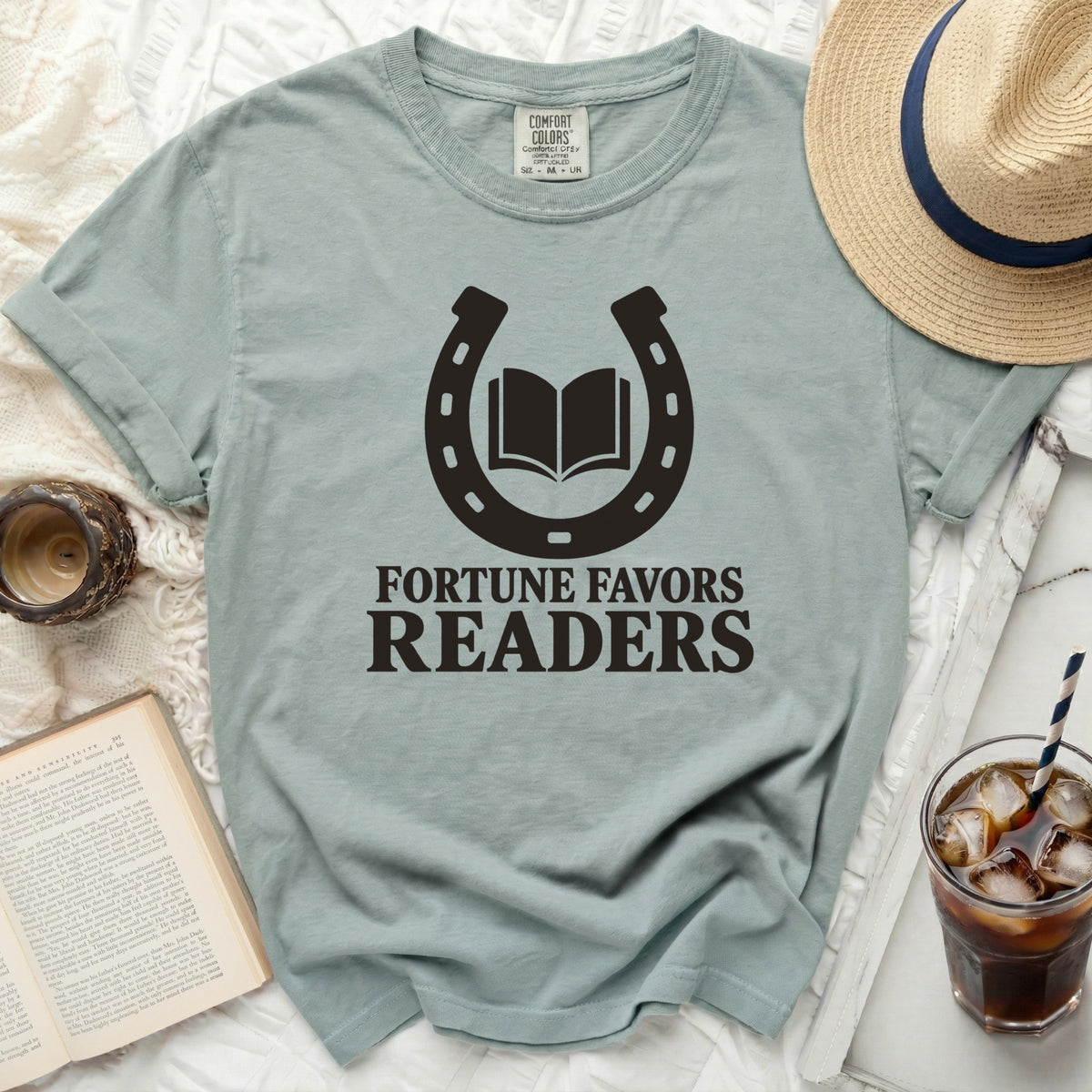 Light green t-shirt with "Fortune Favors Readers" and horseshoe graphic.