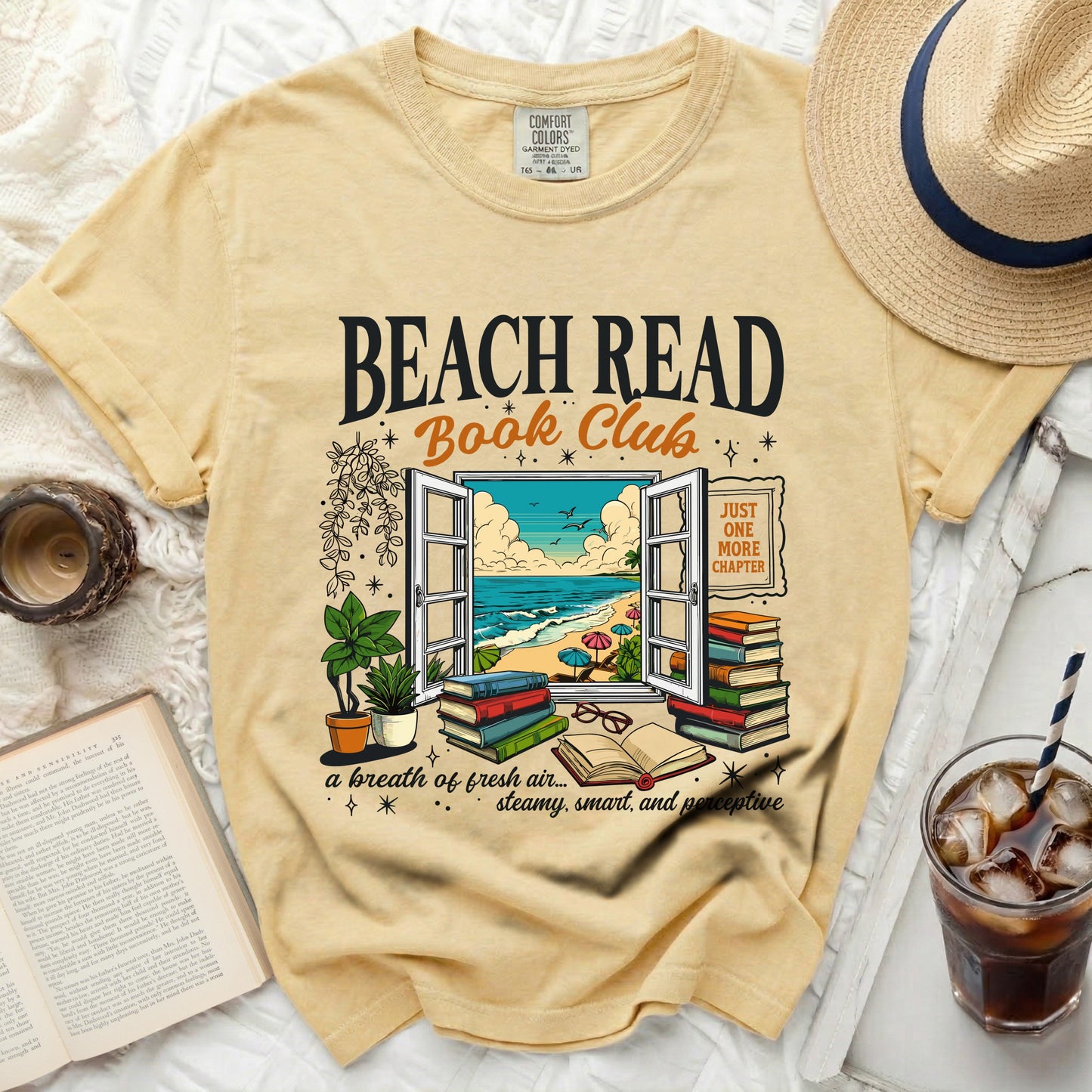 T-shirt with "BEACH READ Book Club" and beach scene design.