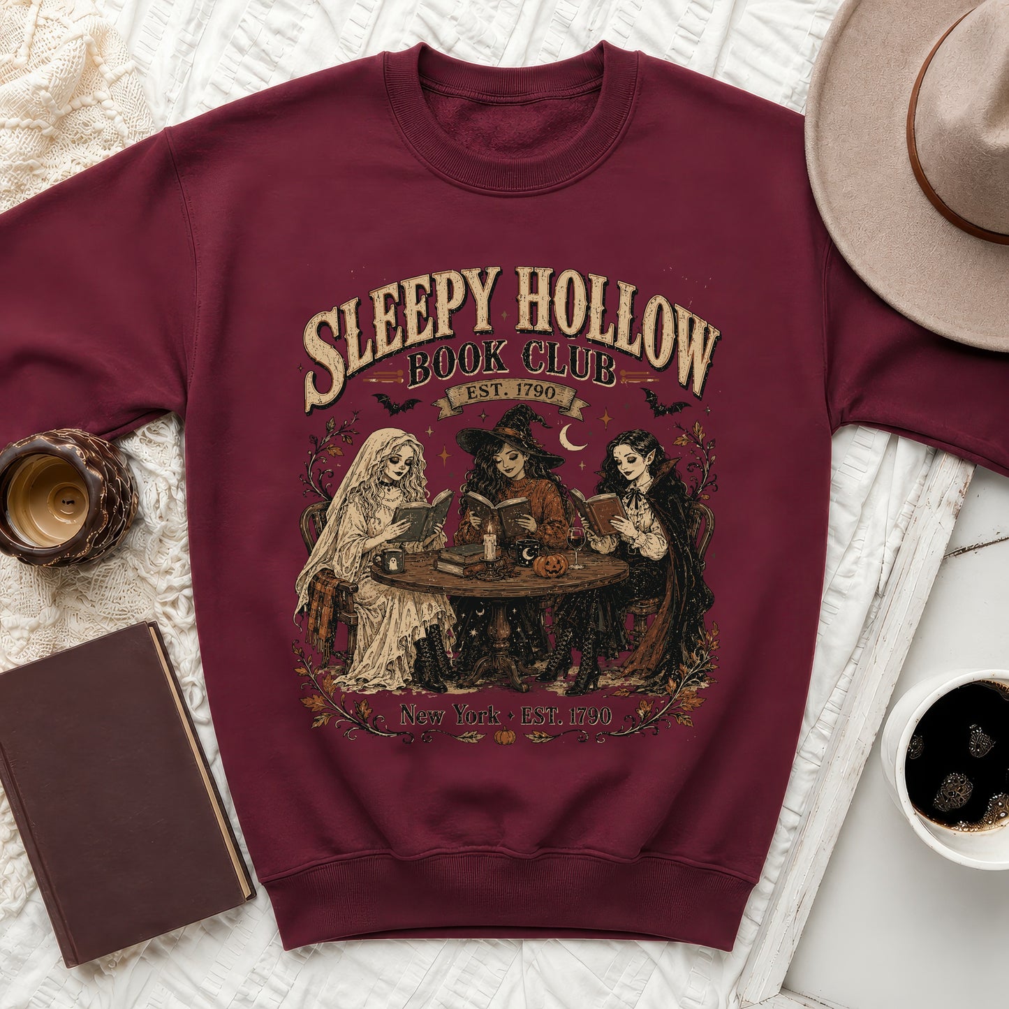 Burgundy sweatshirt with Sleepy Hollow Book Club graphic and three witches reading.