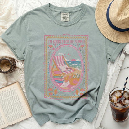 T-shirt with "I'm Booked for the Summer" text and beach scene graphic.
