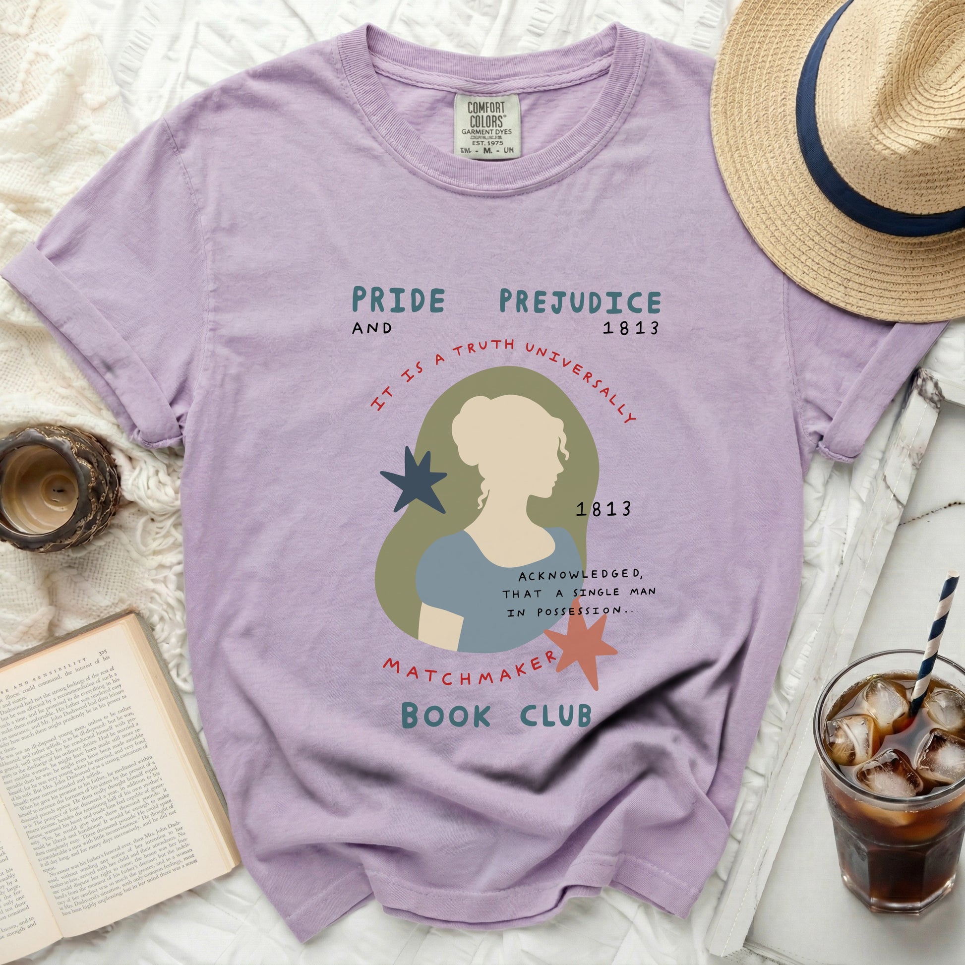 Purple t-shirt with "Pride and Prejudice" and literary graphic.