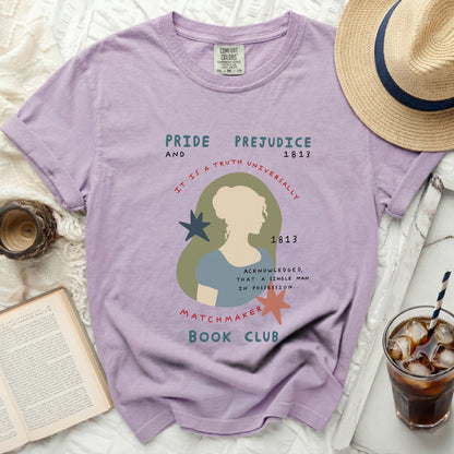 Purple t-shirt with "Pride and Prejudice" and literary graphic.