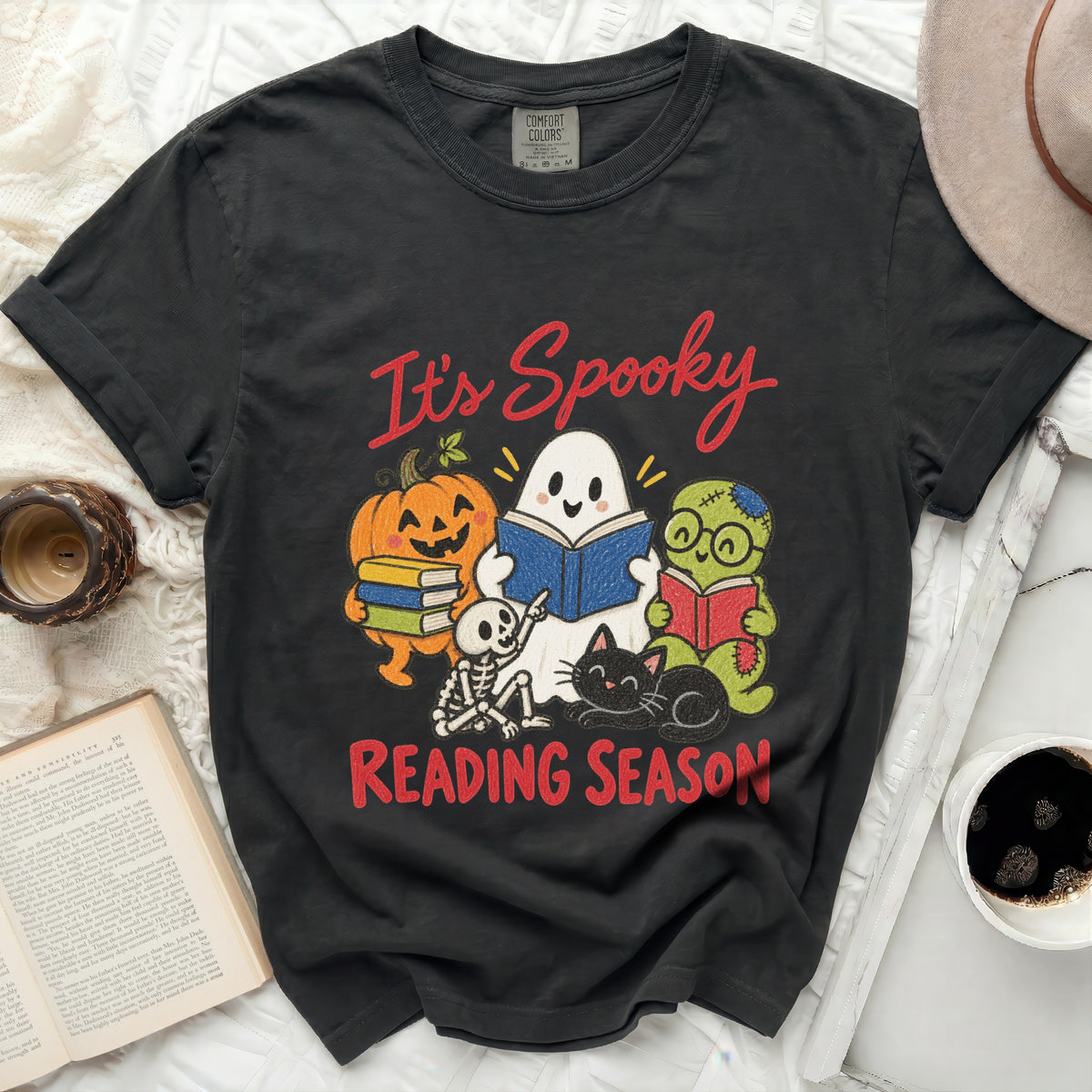 Black t-shirt with "It's Spooky Reading Season" and Halloween characters reading books.