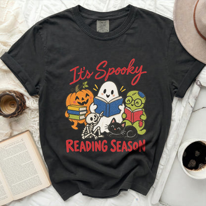 Black t-shirt with "It's Spooky Reading Season" and Halloween characters reading books.