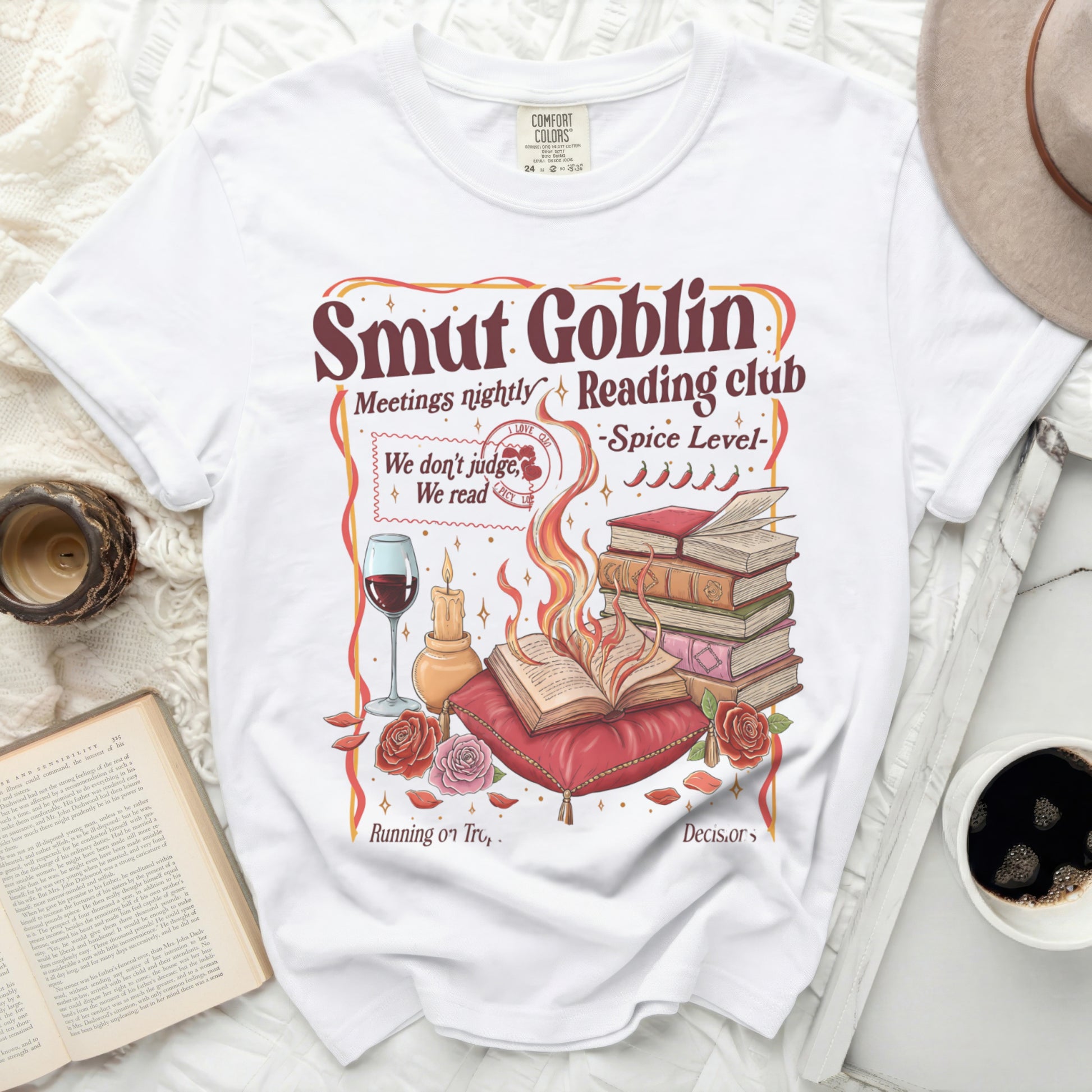 White t-shirt with "Smut Goblin Reading Club" graphic and book imagery.