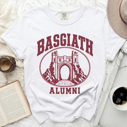 A white t-shirt featuring a maroon graphic of a stone archway, surrounded by the text Basgiath Alumni.