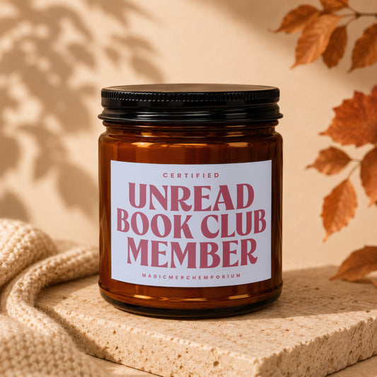 Amber jar candle with "Certified Unread Book Club Member" text and "MagicMerchEmporium" logo.