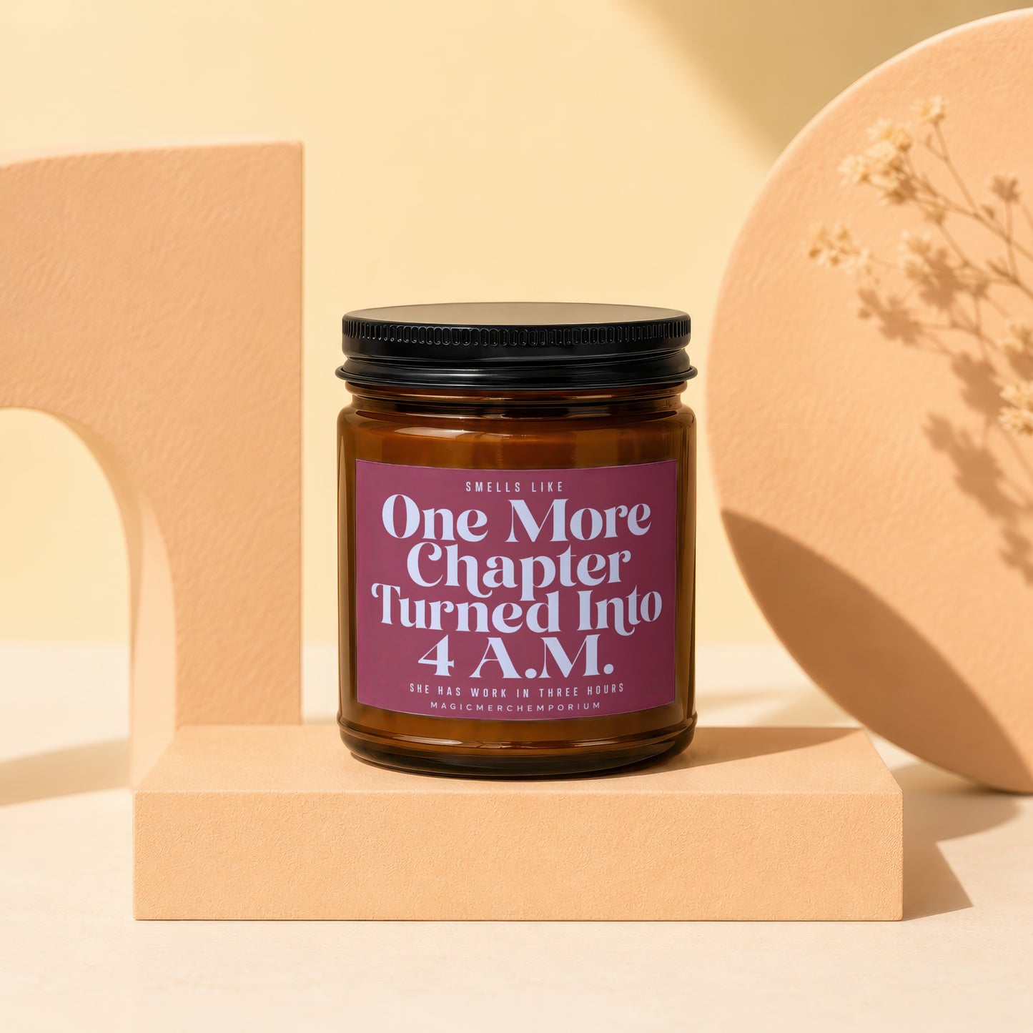 Amber jar candle with purple label reading "One More Chapter Turned Into 4 A.M."