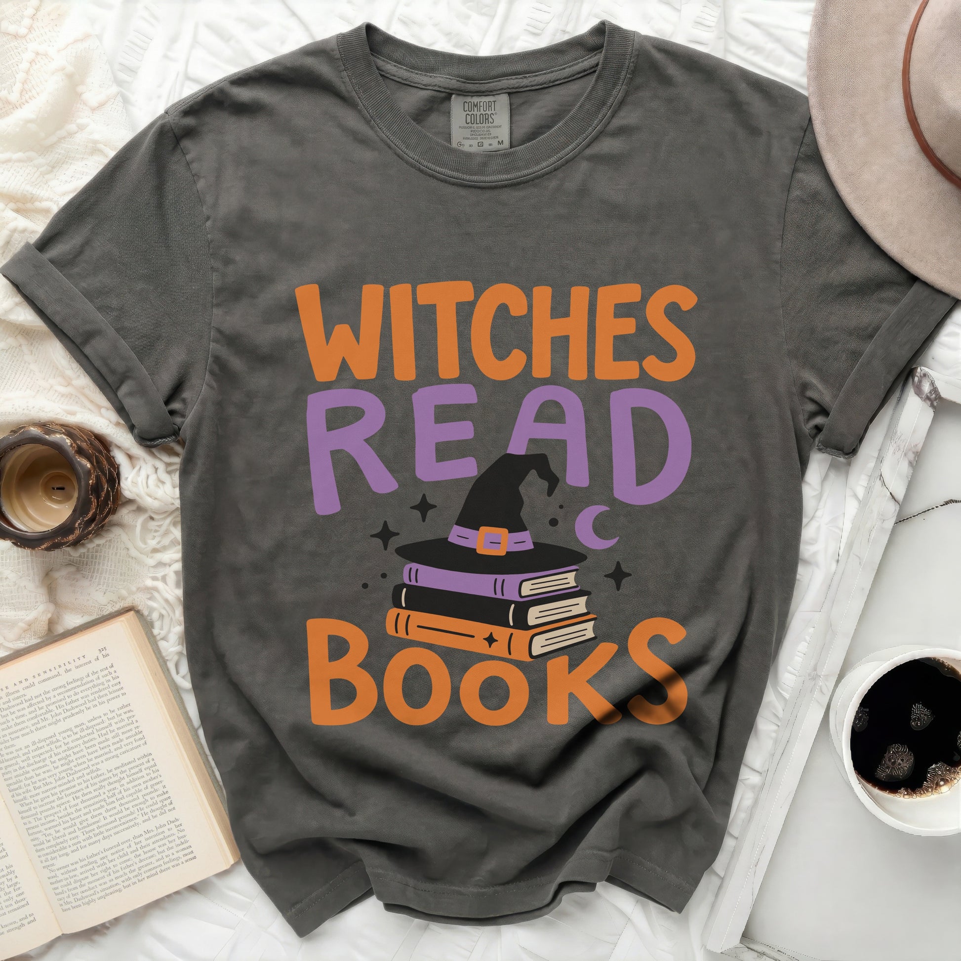 Dark grey t-shirt with "WITCHES READ BOOKS" and witch hat graphic.