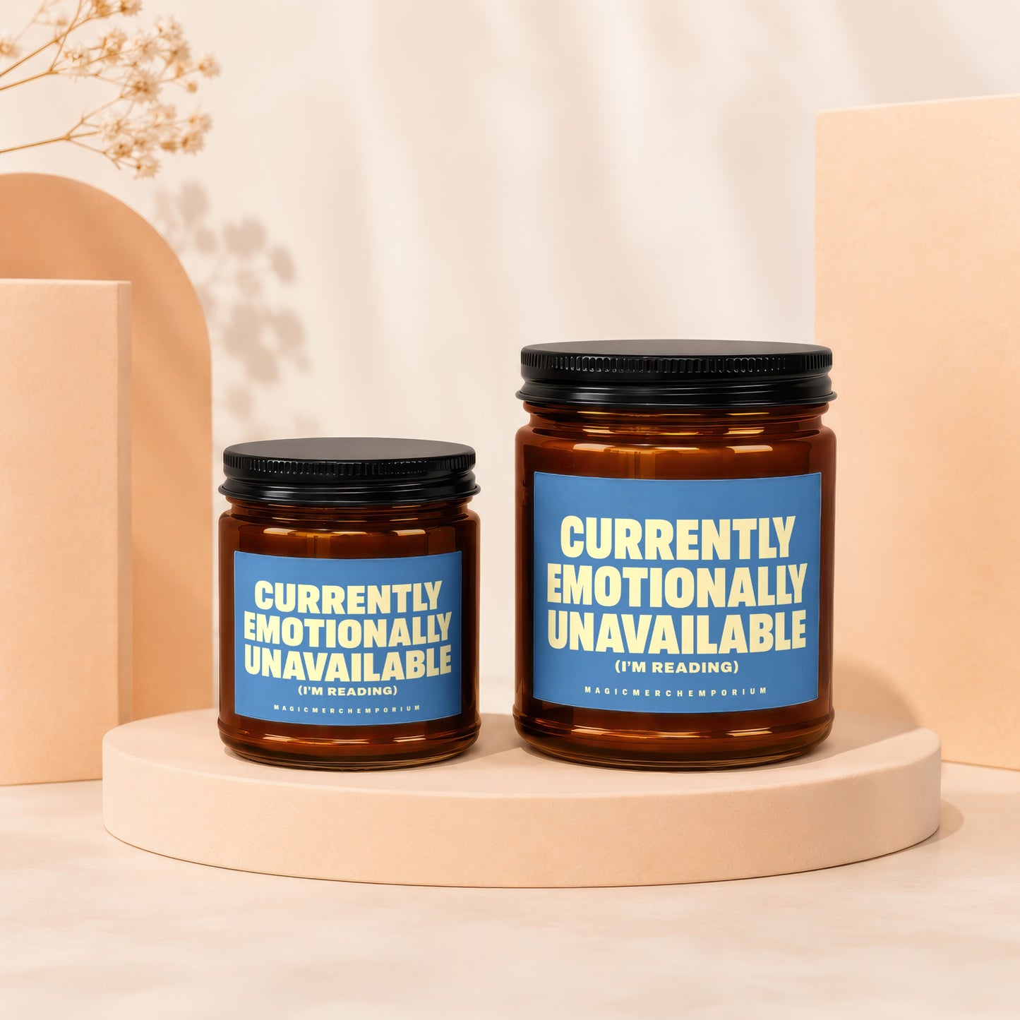 Two candles with blue labels that read "Currently Emotionally Unavailable (I'm Reading)".