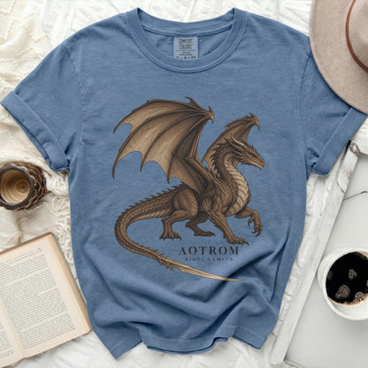 Blue t-shirt with a brown dragon graphic and text "AOTROM RIDOC GAMLYN".