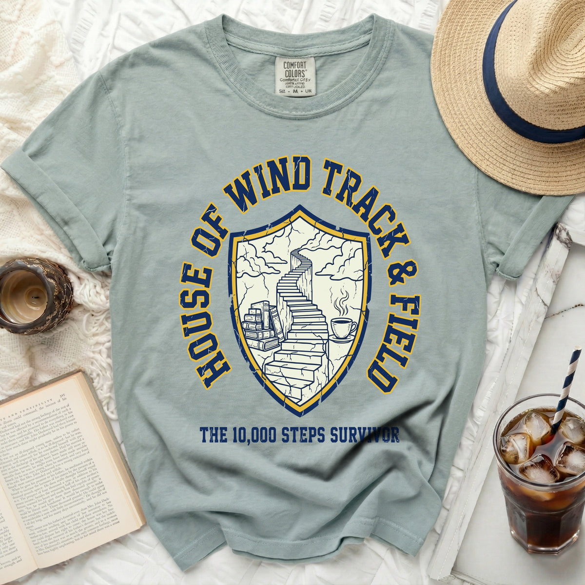 T-shirt with "HOUSE OF WIND TRACK & FIELD" and a shield with stairs