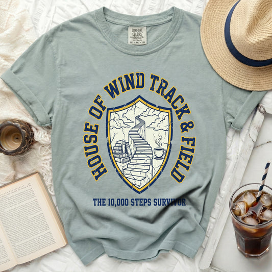 T-shirt with "HOUSE OF WIND TRACK & FIELD" and a shield with stairs