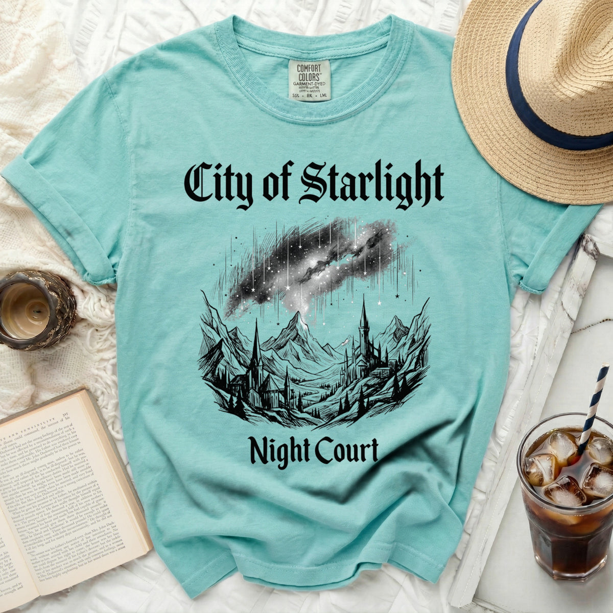 Teal t-shirt with "City of Starlight Night Court" text and castle illustration.