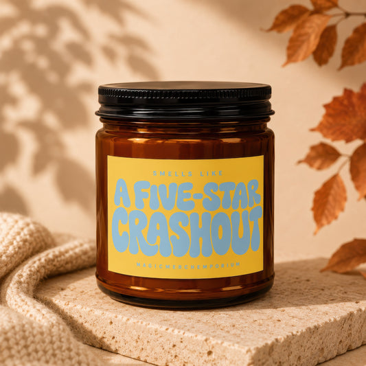 Amber glass candle with yellow label reading "Smells like A Five-Star Crashout."