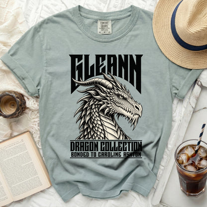 Light green t-shirt with black dragon graphic and text "FLEANN DRAGON COLLECTION BONDED TO CAROLINE ASHTON".
