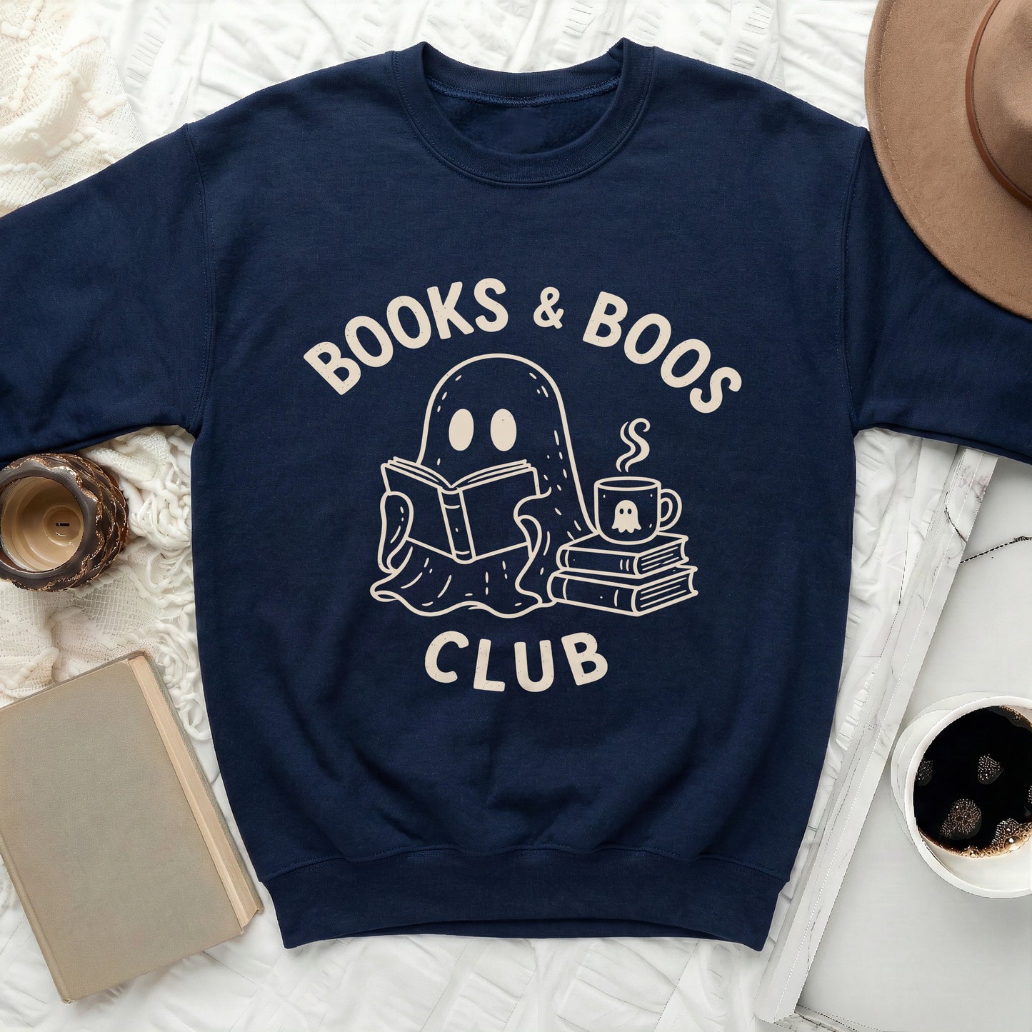 Navy sweatshirt with "Books & Boos Club" text and ghost illustration.