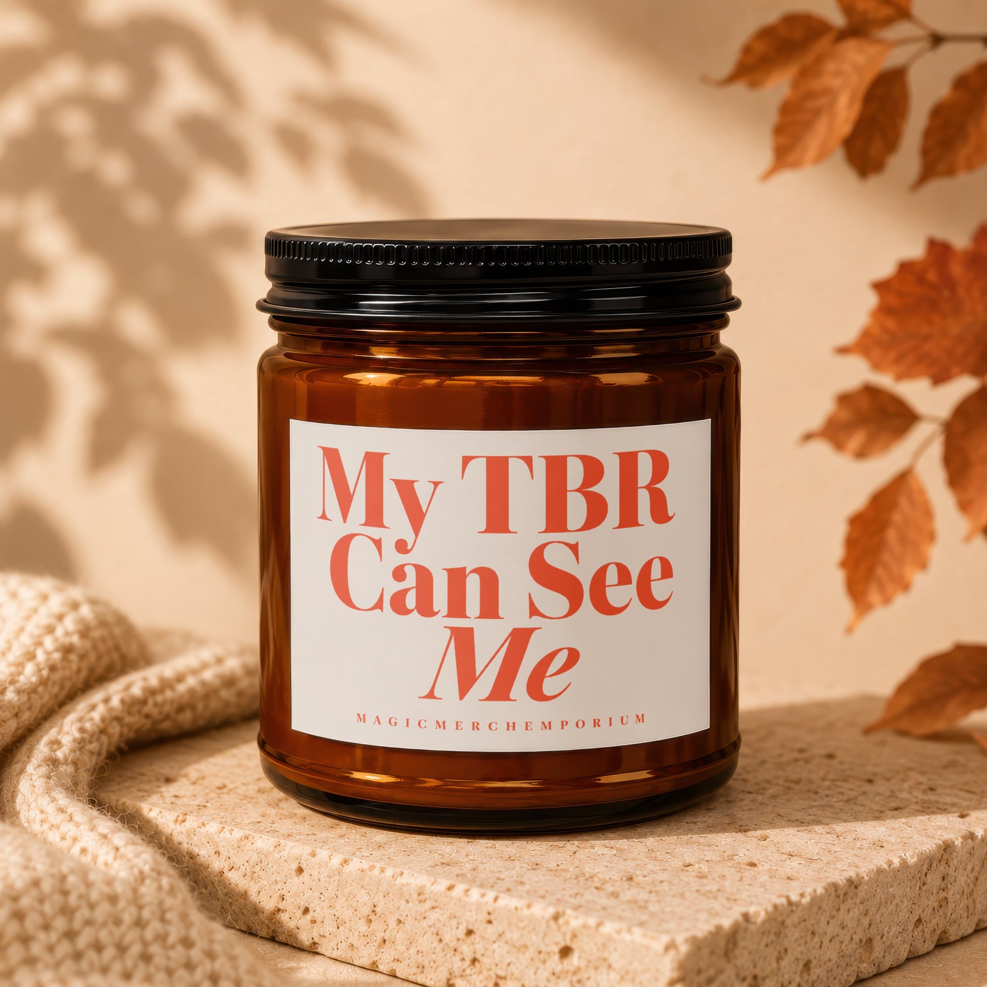 Amber jar candle with white label reading "My TBR Can See Me".