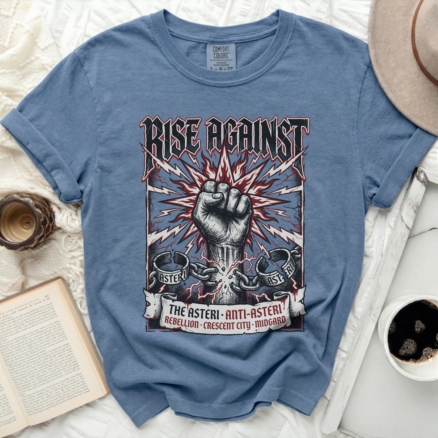 Blue t-shirt with "Rise Against" logo, fist, and text details.