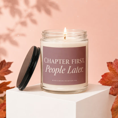 Candle with the words "Chapter First. People Later." on label, with lid off.