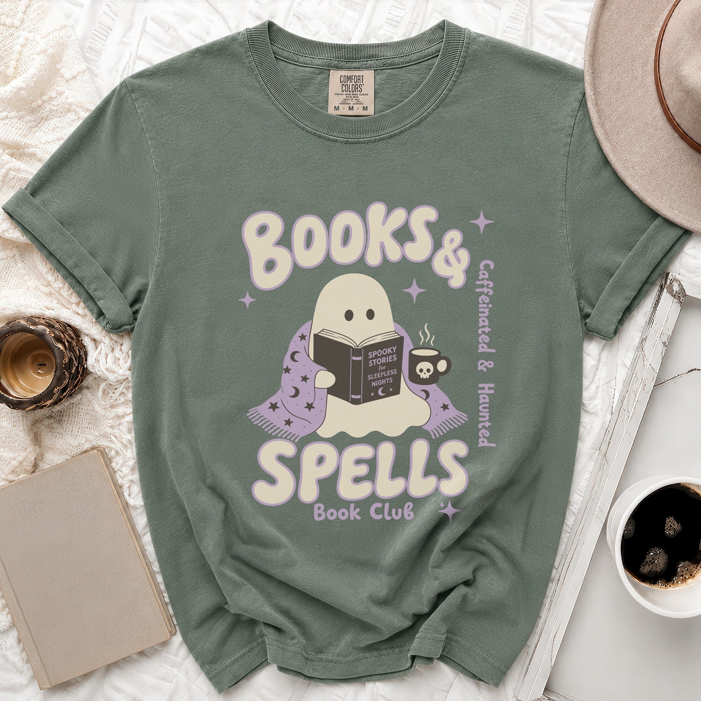 Green t-shirt with ghost reading "Spooky Stories for Sleepless Nights," "Books & Spells Book Club" text.