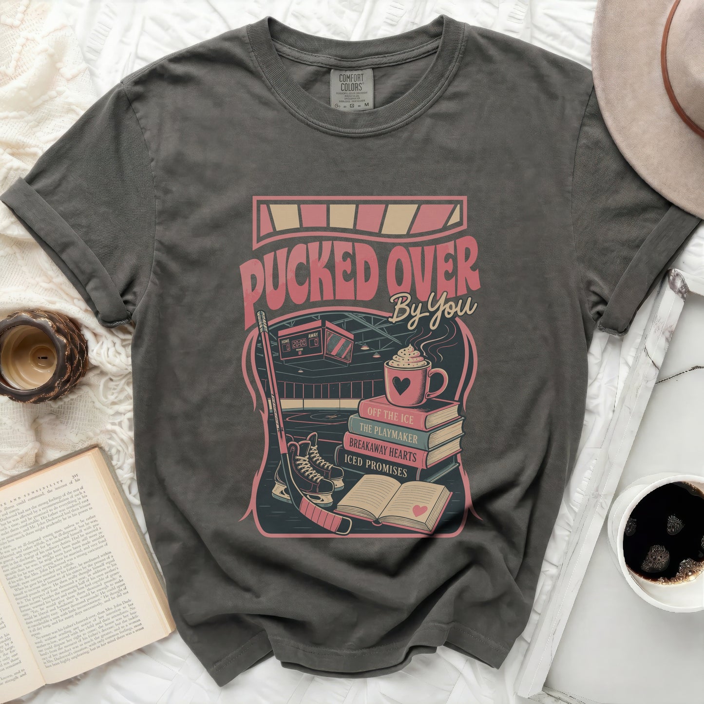 T-shirt with "Pucked Over By You" text and hockey graphics.