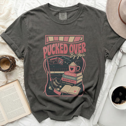 T-shirt with "Pucked Over By You" text and hockey graphics.