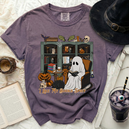 Ghost reading a book with pumpkins and a black cat, "I like my books spicy and my coffee."