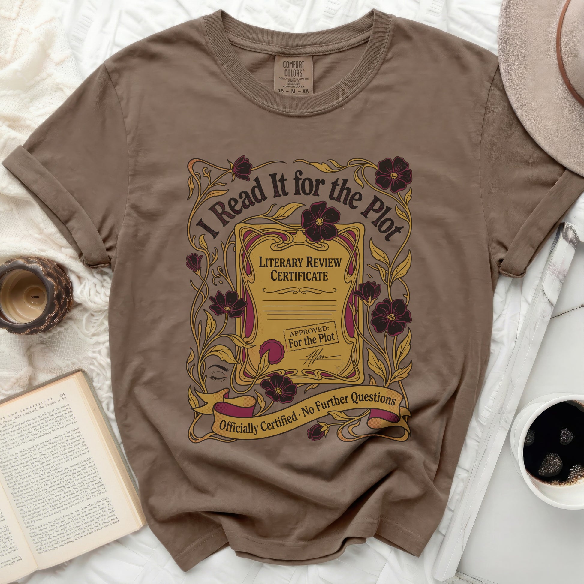 Brown t-shirt with "I Read It for the Plot" literary review certificate design.