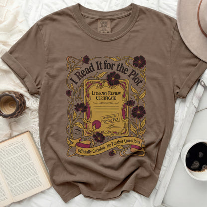 Brown t-shirt with "I Read It for the Plot" literary review certificate design.