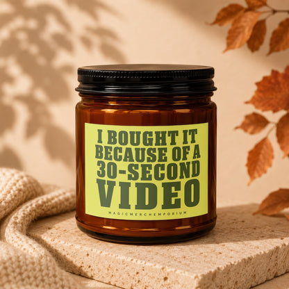 Brown glass candle labeled "I BOUGHT IT BECAUSE OF A 30-SECOND VIDEO".