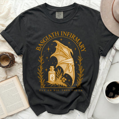 Charcoal black t-shirt featuring a gold print of a dragon wing, a potion bottle, and Basgiath Infirmary text.