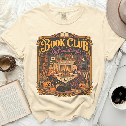 Cream t-shirt with "Book Club By Candlelight" Halloween-themed graphic.