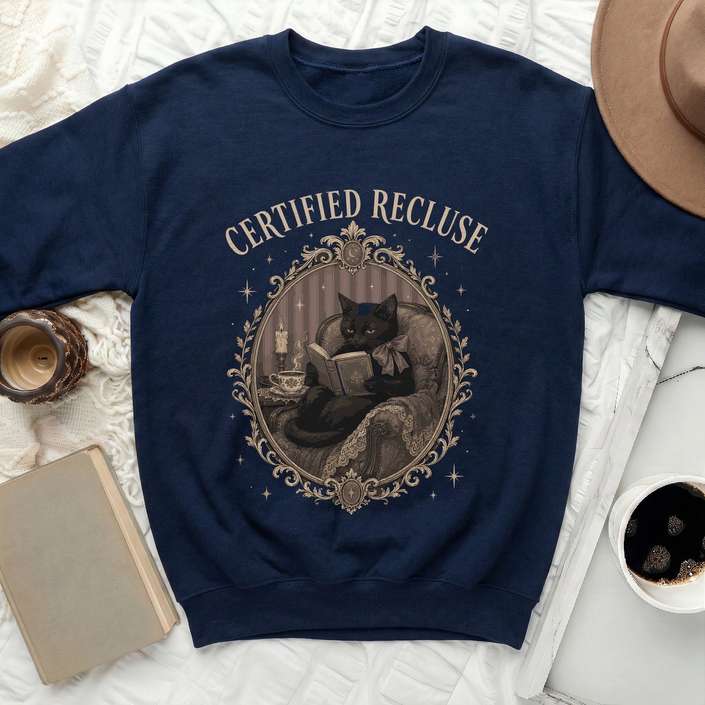 Navy sweatshirt with art of "Certified Recluse" black cat reading book